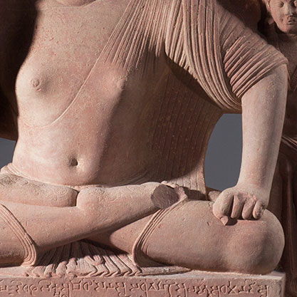 Detail of the red sandstone material that makes up Seated Buddha with Two Attendants