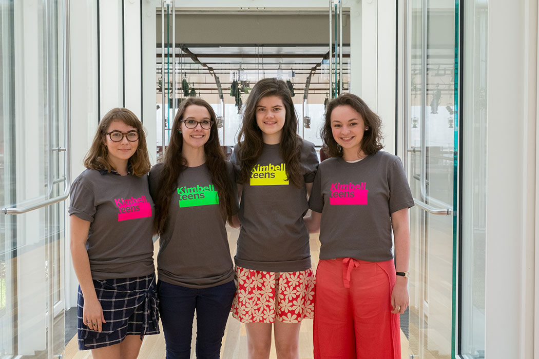 group photo of four students wearing Kimbell teens t-shirts