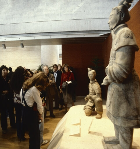visitors admiring sculptures in the Treasures from the Bronze Age of China exhibition
